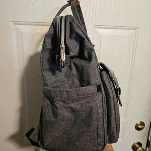 Lekebaby diaper bag backpack in a gray and white arrow print.